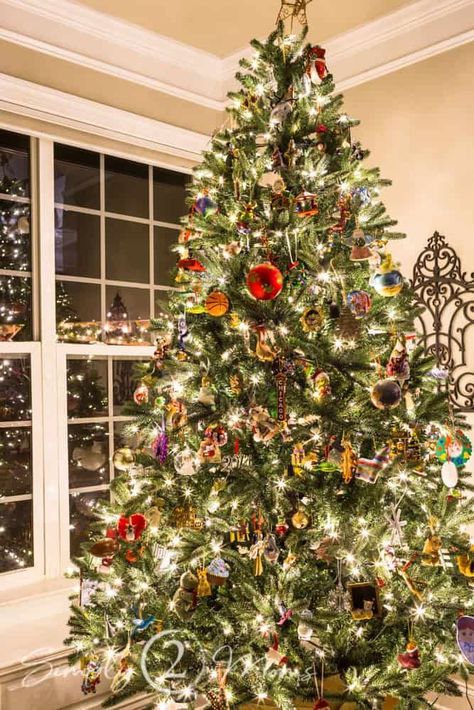 Learn how to decorate a meaningful Christmas tree using all those sentimental ornaments you've collected over the years. #simply2moms #Christmasmemories How To Add Ornaments To Christmas Tree, Christmas Tree Random Ornaments, Christmas Tree With Personal Ornaments, Sentimental Christmas Tree, Sentimental Ornaments, 9 Foot Christmas Tree, Christmas Card Book, First Christmas Tree, Heirloom Ornaments