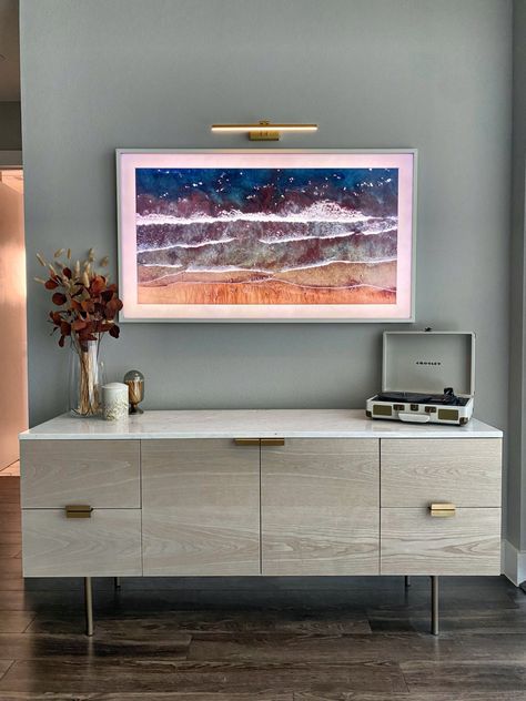 Picture Light Above Frame Tv, Picture Light Above Tv, Picture Light Over Frame Tv, Samsung Frame Tv With Sconces, Picture Frame Tv With Sound Bar, Tv Console Styling, Frame Tv Painting Light, Picture Frame Tv, Temple House