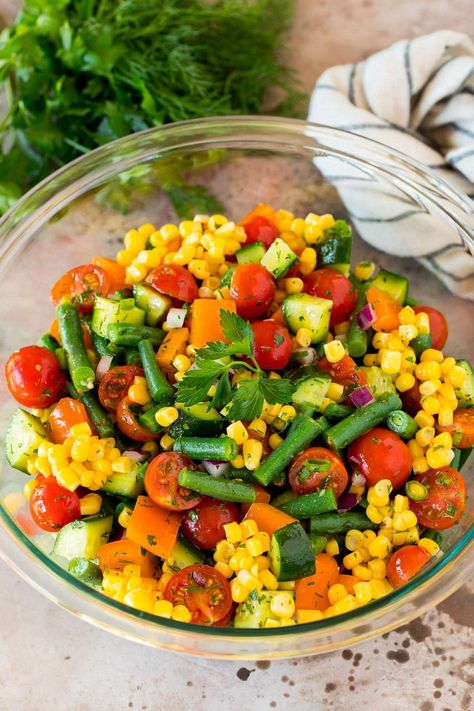 This vegetable salad is a fresh and colorful blend of chopped corn, cucumbers, tomatoes, red onion and green beans in homemade dressing. Chopped Vegetable Salad, Side Salads, Homemade Dressing, Vegetable Salad, Side Salad, Red Onion, Green Beans, Tomatoes, Corn