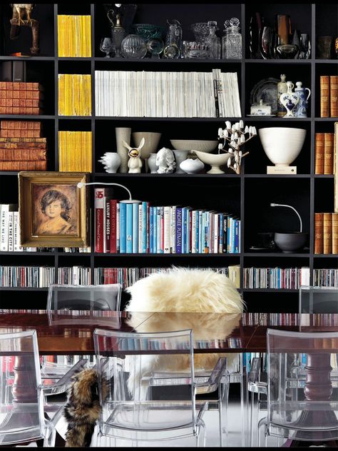 Love the dark bookshelf and national geographics! National Geographic Bookshelf, Bookshelves Arrangement, Eclectic Bookshelf Styling, Dark Bookshelf, Bookshelf Wealth, Dark Bookshelves, Book Shelf Styling, Black Bookshelves, Masculine Home Office