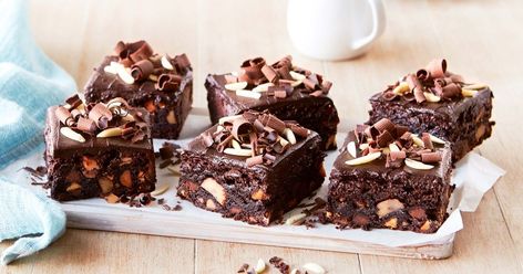 Satisfy your sweet tooth with a scoop of vanilla ice-cream and one of these chewy chocolate and macadamia fudge brownies.