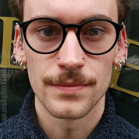 21 Cool Nose Piercing Ideas For Men Man Piercing Nose, Men’s Piercings Nose, Face Piercings Aesthetic Men, Nose Piercing Men Septum, Men’s Septum Piercing, Men Facial Piercings, Men Face Piercing, Double Nose Piercing Men, Men’s Nose Piercing