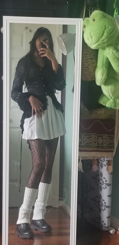 girl in the mirror wearing a black corset top, white pleated skirt, spiderweb tights, white leg warmers, and black boots Leg And Arm Warmers Outfits, Ankle Warmers Outfit Aesthetic, Leg Warmer Aesthetic, Goth Leg Warmers Outfit, Spiderweb Tights Outfit, Dress And Leg Warmers Outfit, Leg Warmers With Boots Outfit, Leg Warmers With Tights, How To Style Leg Warmers With Pants