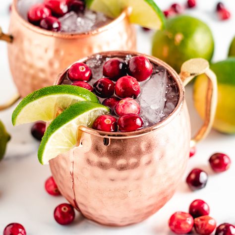 Our Cranberry Moscow Mule is perfect for the holiday season made with cranberry juice, fresh cranberries, ginger beer, and vodka! Cranberry Moscow Mule Recipe, Vodka Cranberry Cocktail, Cranberry Moscow Mule, Peppermint Patty Recipe, Chocolate Walnut Fudge, Salty Recipes, Themed Recipes, Walnut Fudge, Peanut Butter Balls Recipe