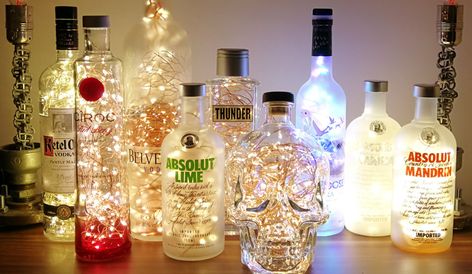 Diy Centrepieces, Liquor Bottle Lights, Alcohol Bottle Decorations, Alcohol Bottle Crafts, Liquor Bottle Crafts, Shed Decor, Bottle Centerpieces, Colorful Drinks, Gift Wrapping Techniques