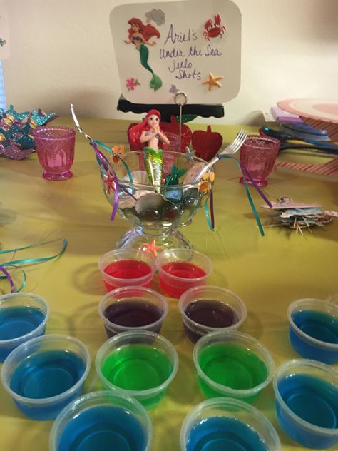 jello-shots with Titos Vodka and some with Smirnoff Whipped Cream Vodka. Red for her hair, purple for her shells, green for her tail and blue for the ocean. My adult Disney Princess 40th Birthday Party. Disney Themed 18th Birthday Party, Disney Theme 30th Birthday, Disney Themed 21st Birthday Party Ideas, Disney Princess Party For Adults, Disney 18th Birthday Party, Disney Themed 30th Birthday Party, Disney 30th Birthday Party, Disney Birthday Party For Adults, Disney 21st Birthday Ideas