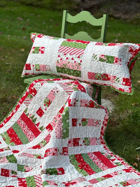 Haul out the tissue, paper and bows! It's time for a wrapping party! Get festive making this beautiful set for the holidays! Finished Quilt is 63" x 75" Pillow measures 16" x 38" 12" block size Advanced Beginner skill level All sales are finalSee policies and terms for further information Quilt Pattern With Squares, Simple Christmas Quilts, Jelly Roll Christmas Quilt Patterns, Nine Patch Quilt Patterns Ideas, Easy Christmas Quilt Patterns, Christmas Quilt Blocks Free Pattern, Christmas Wrapping Party, Christmas Quilts Ideas Free Pattern, Winter Quilt Patterns