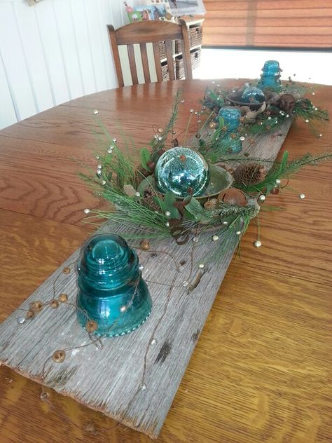 my barn wood insulator Christmas centerpiece table with vintage silver bells. Blue Insulators Ideas, Insulator Crafts, Insulator Ideas, Christmas Centrepiece Table, Christmas Tree Gift Tags, Centerpiece Table, Christmas Centerpieces Diy, Glass Insulators, Christmas Centerpiece