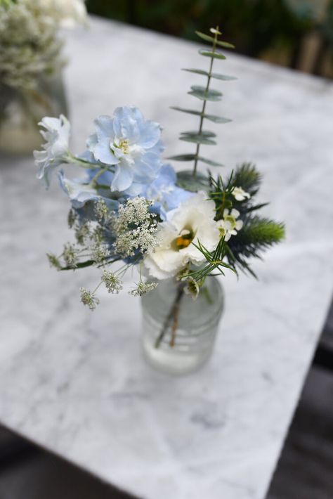 Blue Wild Flower Centerpieces, Light Blue Floral Centerpieces, Mismatched Centerpieces Wedding, Dusty Blue And Sage Green Floral Arrangements, Blue Bud Vase Centerpiece, Flower Arrangements For Table Wedding, Blue Flowers Centerpiece, Coastal Wedding Colors, Coastal Wedding Flowers