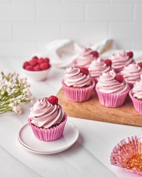 These Raspberry Cupcakes have a super-strong raspberry flavor and it all comes from using real raspberries! There is raspberry cake, raspberry filling and a raspberry frosting. The recipe has no artificial flavoring and tastes tart and sweet - perfect for spring baking! They have a naturally pink color from the raspberries, the filling is a raspberry sauce made from scratch which is also used to flavor the cupcakes and frosting. The frosting is a raspberry Russian buttercream - super glossy! Cake Raspberry Filling, Cupcakes With Raspberry Filling, Russian Buttercream, Lemon Raspberry Cupcakes, Cake Raspberry, Raspberry Frosting, Raspberry Coulis, Raspberry Cupcakes, Spring Baking