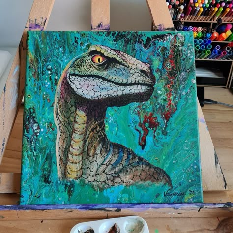 The poured background on this square canvas is full of greenish colors, with some pops of red and dark brown. In the center I painted a raptor face and neck only, with his head turned so one eye is looking down and a bit scary. The mouth of the dinosaur is closed because I didn't want to make him look too scary, since the boy who received it for his birthday only just turned 5 years old. Trex Dinosaur Painting, Paintings Of Dinosaurs, Dinasour Watercolor Painting, Dinosaur Painting Acrylic Easy, Jurassic Park Painting Canvas, Acrylic Painting Dinosaur, Oil Pastel Dinosaur, Cute Dinosaur Painting Acrylic, Dino Painting Ideas