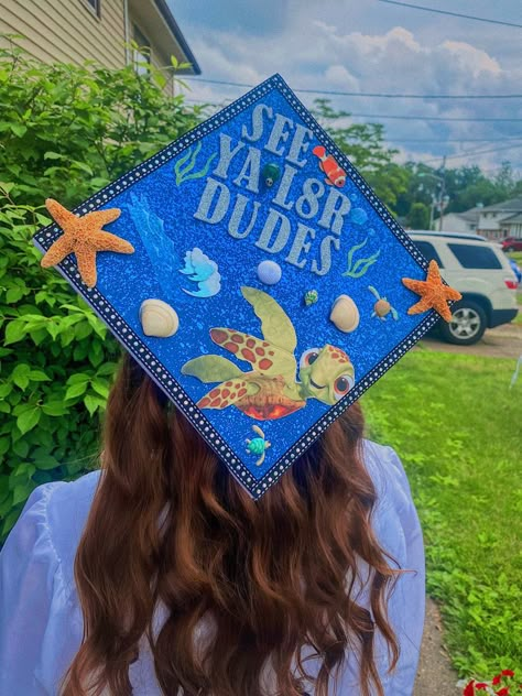 5th Grade Cap Decoration, Kindergarten Grad Cap Ideas, Hawaiian Graduation Cap Ideas, Finding Dory Graduation Cap, Grad Cap Designs Disney, Cars Graduation Cap, Finding Nemo Graduation Cap, Marine Biology Cap Decoration, Nemo Graduation Cap