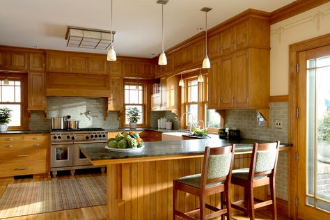 The historic language of the existing house inspired the scale, size, and proportions of the addition in this Prairie School-style house on Summit Avenue. Closed Kitchen Design, Wolf Kitchen, 1920s Kitchen, Dark Wood Trim, Closed Kitchen, Prairie School, Farmhouse Backsplash, Classic White Kitchen, Prairie Style Houses