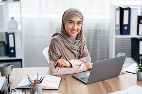 Millennial Muslim Girl In Headscarf Posing At Workplace In Modern Office by Prostock-studio. Business Career For Islamic Women. Portrait Of Millennial Muslim Girl In Headscarf Posing At Workplace In Modern Office #AD #Posing, #Workplace, #Modern, #Headscarf Inspirational Quotes About Time, Female Manager, Business Pictures, Women Portrait, Hijabi Aesthetic, Digital Tablet, Graphic Designer Portfolio, Female Doctor, Drinking Coffee