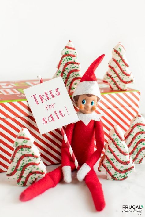 Elf on the Shelf Trees for Sale. Grab Little Debbie Christmas Tree Cakes and create this adorable little Christmas Tree Patch. #FrugalCouponLiving #ElfontheShelf #ElfontheShelfIdeas #ElfIdeas #funnyelfideas #funnyelfontheshelf #elfprintables #freeelfprintables #printables #freeprintables #christmastree #littledebbie #treesforsale Shelf Christmas Tree, Classroom Elf, Elf Printables, Elf Mischief, Elf Of The Shelf, Elf Tree, Christmas Tree Lots, Elf Shelf, Elf Kit