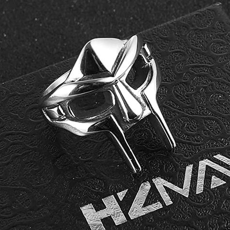 The Ring From the world of medieval knighthood, recreating the artful design of the helmet down to the most minute detail It create a man’s ring that the super hero fan would like.It symbolizes the militant and brave spirit of a fighting nation, as well as an attachment to a Viking fan for Women And Men. 90 DAY MONEY BACK GUARANTEE-100% satisfaction guaranteed. That is our promise. So, if you're not completely happy with your purchase within the first 90 days, just let us know. Mf Doom Ring, Mf Doom Mask, Viking Rings, Metal Mask, Hip Hop Party, Mf Doom, Viking Ring, Hand Accessories, Punk Vintage