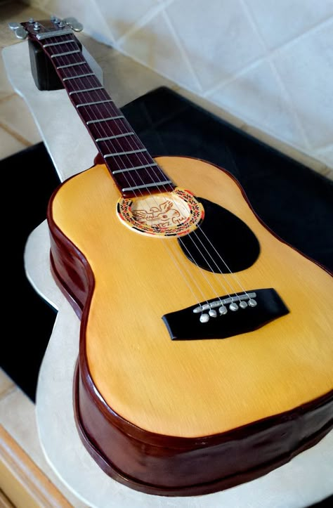 Guitar cake.  So proud of this little beauty. #cake #guitar #guitarcake #edibleart #fondant #fondantart #carvedcake Guitar Cakes, Guitar Cake Ideas, Guitar Theme Cake, Fondant Guitar, Guitar Cakes For Men Birthday, Guitar Inspired Cake, Music Birthday Cakes, Birthday Cake Guitar Theme, Guitar Birthday Cakes