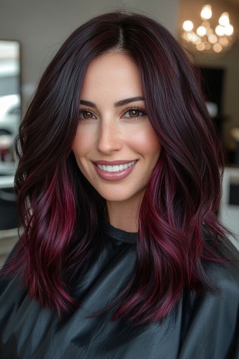 Looking to spice up your hair game? Dark red hair is the perfect way to add a bold and sultry touch to your look. 💋 #darkredhair #hairinspo #boldbeauty #sultryvibes #hairgoals #redhot 🔥 Whether you opt for a deep burgundy or a fiery auburn, this color is sure to turn heads and make a statement. 💁‍♀️ #statementhair #hairtransformation Don't be afraid to go dark and embrace your inner vixen with dark red hair. 💄 #vixenvibes #haircolor #confidenceboost #beauty #hairtrends Hair Color Ideas For Brunettes With Red Burgundy Dark Brown, Cool Tone Burgundy Hair, Dark Brown Hair With Red Streaks, Black Cherry Hair Color Brown Skin, Vampire Hair Color, Red Streaks In Hair, Dark Brown Hair With Red Balayage, Burgundy Balayage Brunettes, Dark Brown To Red Ombre