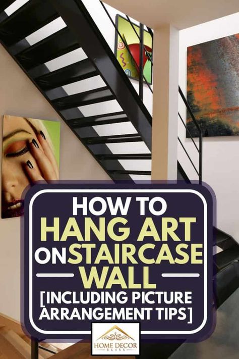 How to Hang Art on Staircase Wall [Inc. Picture Arrangement Tips] - Home Decor Bliss Art For Stairway Wall, Hanging Art On Staircase Wall, Staircase Design Artwork, Hanging Art In A Stair Well, Staircase Artwork, How To Hang Art On Staircase Wall, Art On Staircase Wall, Staircase Makeover Artwork, Large Stairway Wall Decor