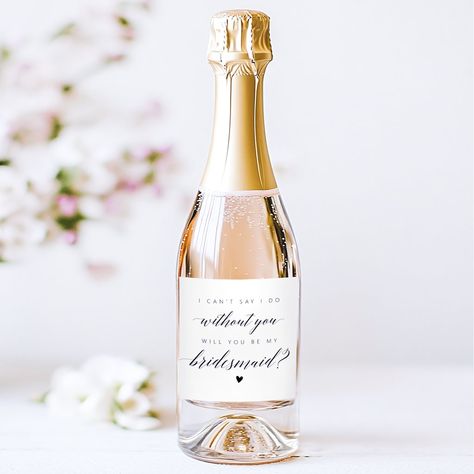 Bridesmaid Proposal Minimalist Calligraphy Sparkling Wine Label
This elegant black and white sparkling wine label features minimalist calligraphy, asking, "Will you be my bridesmaid?" Its modern and classic design creates a simple yet sophisticated touch, perfect for a timeless bridesmaid proposal.