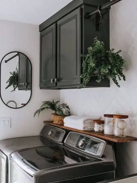 18 Dark & Moody Laundry Room Decor Ideas » Lady Decluttered Paint Ideas For Laundry Room, Over Laundry Cabinets, Black And Wood Laundry Room, Laundry Room With Dark Cabinets, Mudroom Ideas Laundry Room, Dark Washer And Dryer Laundry Room, Dark Green Laundry Room Cabinets, Black Cabinet Laundry Room, Small Laundry Room Dark Cabinets