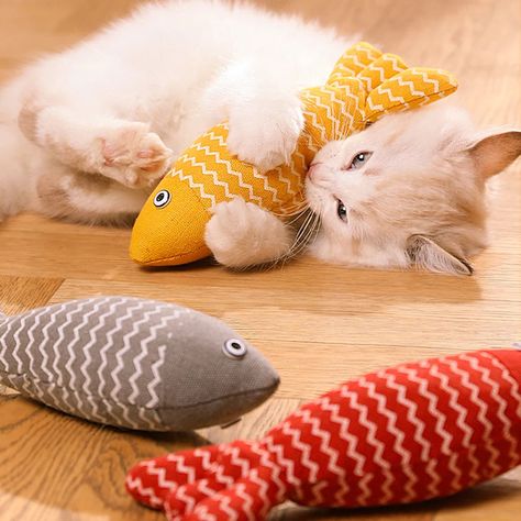 Unleash Your Cat's Wild Side with Realistic Fish Toys： Engage your cat's instincts with our set of 1 soft linen fish toys in vibrant colors. These toys are designed for biting, chewing, and scratching, providing endless entertainment. Organic Catnip Stimulation for Interactive Play: Our cat toys are stuffed with 100% pure and potent organic catnip, ensuring your kitty's excitement during playtime. Catnip, a favorite natural herb, creates an irresistible and interactive experience. Safe and Versatile Fun for Cats of All Ages: With your cat's safety in mind, our toys are hand-sewn without glue or zippers to prevent accidental swallowing. Suitable for kittens and adult cats, they offer both comfort and enrichment. Keep Your Indoor Cat Active with Catnip and Silvervine: Provide mental stimulat Fish Toy, Interactive Experience, Toy Room, Toy Rooms, Interactive Play, Indoor Cat, Cat Supplies, Pet Cat, Cat Stuff