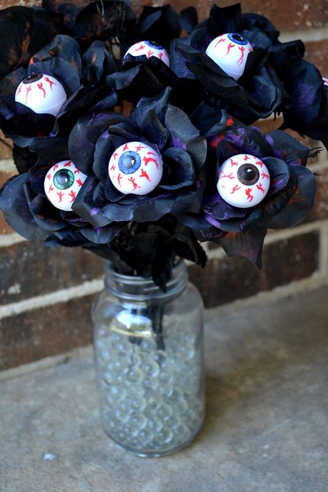 Eyeball Flowers Porch Decor DIY. Make these cheap and easy eyeball flowers and create a mini graveyard on your porch this Halloween. Halloween decor. Halloween props. Halloween DIY. Halloween Office Decor Ideas, Halloween Decor For Office Desk, Eyeballs Halloween Decorations, Fall Office Decor Work Diy, Halloween Desk Decorations, Eyeball Halloween Decorations Diy, Witch Cubicle Decor, Halloween Cubicle Decor Ideas, Office Halloween