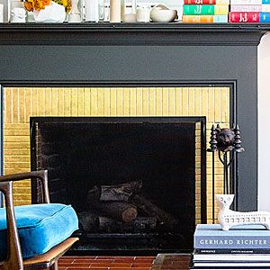 Add glitz to your space with gold leaf over fireplace brick. Metallics make almost any palette more dynamic. Gold Brick Fireplace, Dopamine Decorating, Gold Fireplace, Art Deco Home Design, Fireplace Brick, Black Fireplace, Bricks Diy, Bold Color Schemes, Contemporary Fireplace