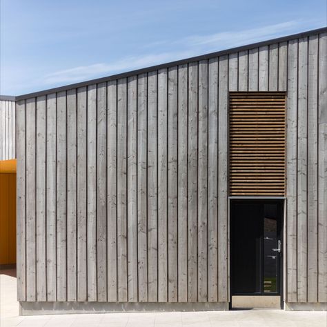 Scottish Larch Cladding used on commercial building on the Isle of Harris Hit And Miss Timber Cladding, Board On Board Cladding, Hit And Miss Cladding, External Timber Cladding, Charred Larch Cladding, Weathered Timber Cladding, Vertical Wooden Cladding Exterior, External Wood Cladding, Shed Cladding Ideas