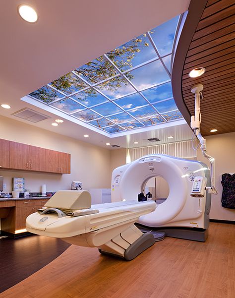 Sutter Diagnostic & Women's Imaging in Roseville, CA, create a patient-centered, spa-like atmosphere with biophilic design elements like warm wood grain surfaces and illusory skies that engage spatial perception. Hospital Design Architecture, Healthcare Interior Design, Medical Office Design, Hospital Architecture, Healthcare Architecture, Hospital Interior, Clinic Interior Design, Dental Office Design, Operating Room