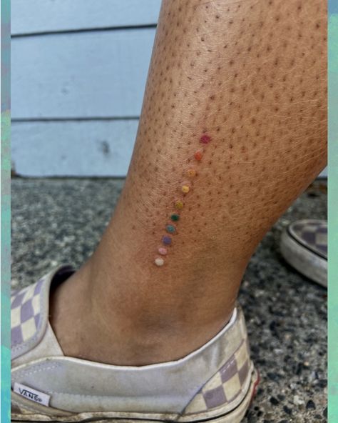 Tattoo Color Test Ideas, Rainbow Dots Tattoo, Color Test Tattoo Ideas, Colour Line Tattoo, Coloured Tattoo On Dark Skin, Tattoo Color Test, Blue Dot Tattoo, Color Test Tattoo, Color Tattoos On Dark Skin