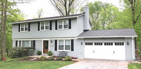 The after of a two-story colonial home with an updated exterior. Update Colonial House Exterior, Updated Colonial Exterior, Colonial Exterior Makeover, Colonial Exterior Remodel, Colonial Curb Appeal, Modern Colonial Exterior, Colonial Remodel, Painted Brick Exteriors, Colonial House Exteriors