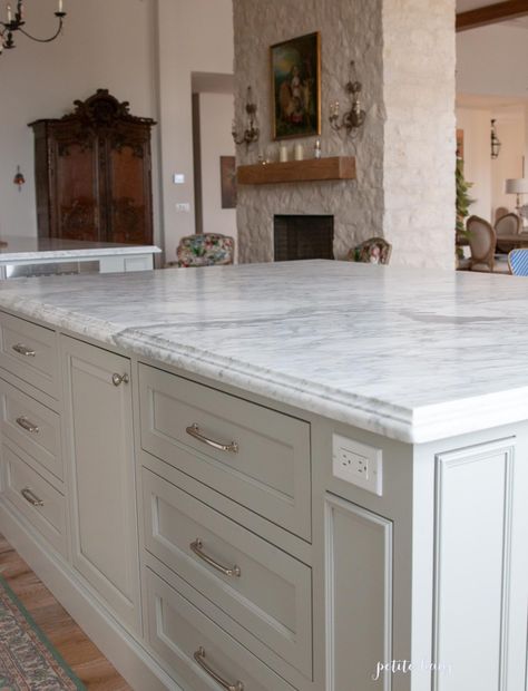 White Kitchen Cabinets With White Marble Countertops, Cream Cabinets With Marble Countertop, Marble Countertop Edges, Kitchen Island Marble And Wood, Beveled Marble Countertop, Carrera Marble Countertops Kitchen, Aged Marble Countertops, Types Of Marble Countertops, Marble Countertops Wood Cabinets