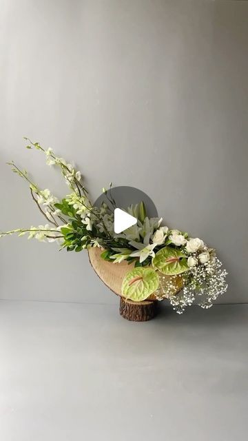 Flagship by Ferns N Petals on Instagram: "“Nature’s Symphony: A charming blend of Anthurium, Liles, Roses, Baby Breath, and wooden log. . Managed By @womenlisted . We are delivering in Delhi NCR To Place Your Order: • Visit Our Website (Link In Bio) Call/WhatsApp us on +91 9999999166/177 . . . . #flagship #flagshipstore #flagshipbyfnp #uniqueFlowerArrangement #FloralDecor #birdnest  #Naturelnside #RusticVibes #CabinLife #CozyAtmosphere #FlowerLove #FlowerArrangement #InteriorDecorating #InteriorDesign #DecoratingWithFlowers #FlowerDaily #FlowerMagic #BeautifulFlowers #NatureLovers #naturalbeauty" Anthurium Arrangement, Unique Floral Arrangements, Unique Flower Arrangements, Ikebana Flower Arrangement, Floral Arrangements Diy, Paper Flower Backdrop, Flower Backdrop, Unique Flowers, Flower Show