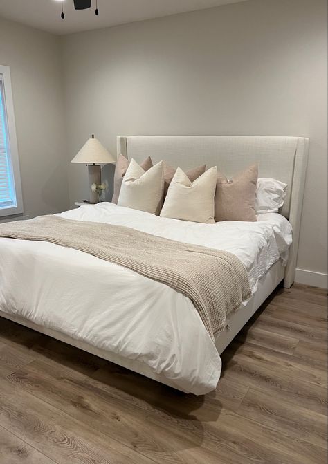 Image of aesthetic neutral upholstered King bed frame with side table and lamp from crate and barrel ~ interior design - beige furniture cream Cream Fabric Bed Frame, Biege Bedroom Idea, Cream Bed Headboard, Beige King Upholstered Bed, Cream King Bed Frame, Off White Bed Frame, Cream Bedframe Ideas, Beige King Bed, Wayfair Bed Frame