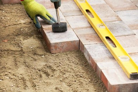 Fix sunken pavers not only because they're an eyesore, but also because they're a safety hazard. Here's how to handle the repair. How To Lay Pavers, Sunken Patio, Pavers Diy, Brick Paver Patio, Garden Pavers, Paver Blocks, Brick Laying, Pavers Backyard, Paver Designs