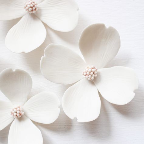 Pretty Dogwood Flowers for a Spring Look all year long! They are made from real biscuit white porcelain The mini-bead center is a delicate shiny pink. This decor includes 5 flowers whose sizes range from around 7cm to 10cm. 2.75in - 3.93in. They have two metal loops at the back for simple and quick hanging. If you have any questions feel free to reach out! See our collections on our website alaingranell.com    Please consider customs fees All our pieces are designed and handmade by ourselves in our french studio Flowers For Wall, Porcelain Decor, Pink Dogwood, Porcelain Earrings, Dogwood Flowers, Pottery Handbuilding, Hand Painted Earrings, Slab Pottery, Spring Look