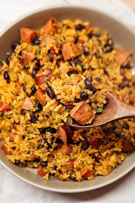 A flavorful and protein packed #onepotdinner loaded with black beans, tomatoes, andouille sausage and rice, perfect for a weeknight.   #onepanmeals #blackbeansandrice #beansandrice #onepotmeal Black Beans And Rice Recipe With Sausage, Keilbasa Black Beans And Rice, Sausage Rice Beans, Black Beans Rice And Sausage, Rice Beans And Sausage, Sausage Beans And Rice Recipes, Beans Rice And Sausage, Kielbasa And Beans, Andouille Sausage And Rice