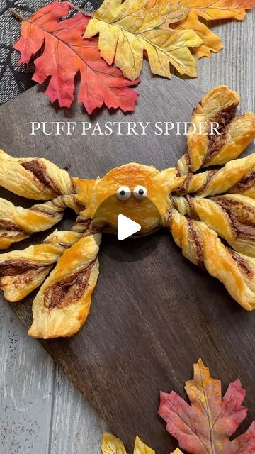 Cheese, Charcuterie, Fun Food Boards & MORE on Instagram: "•PUFF PASTRY SPIDER•

➡️➡️SAVE this recipe for the sweetest, spookiest HALLOWEEN treat! 🕷️🕸️🕷️

INGREDIENTS:
1 sheet puff pastry
Nutella chocolate hazelnut spread 
1 egg

HOW TO: 
1. Thaw puff pastry sheet at room temperature for about 30 minutes. 
2. Preheat oven to 400°.
3. Unfold puff pastry, and with a small rolling pin smooth out folds.
4. Take a knife and cut puff pastry in half. 
5. On one side, spread a generous layer of Nutella. Fold other side over and gently press down. 
6. Take a medium-sized circle cookie cutter and in the center press down to make the outline of a circle.  You do not need to cut all the way through. 
7.  Cut strips off of circle to make “8 legs”. 
8. Remove excess pastry from top and bottom of the Puff Pastry Halloween, Chocolate Charcuterie Board, Puff Pastry Chocolate, Scary Halloween Crafts, Chocolate Spiders, Spooky Halloween Treats, Chocolate Pastry, Halloween Chocolate, Chocolate Nutella