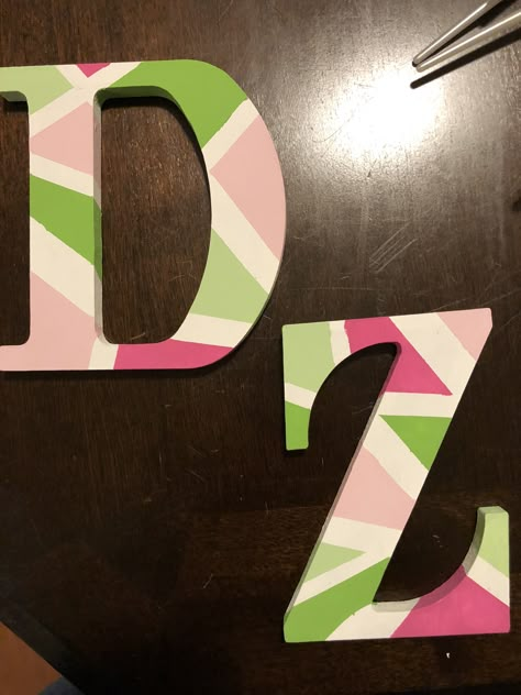 Wooden sorority letters simple design Painting Sorority Letters, Delta Zeta Letters Painted, Kappa Delta Letters Painted, Painting Wooden Letters Designs, Sorority Letters Painted Wooden Pink, Wooden Letter Painting Ideas Design, Sorority Letters Painted Wooden Easy, Painted Greek Letters Wooden, Painted Wood Letters Ideas