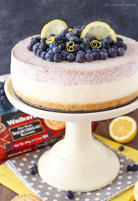 Lemon Blueberry Mousse Cake - This cake is almost entirely no bake and perfect for spring and summer! A layer of blueberry and lemon mousse on top of white chocolate ganache and a Walkers Shortbread crust! Blueberry Mousse Cake, Blueberry Shortbread, Lemon Mousse Cake, Blueberry Mousse, Shortbread Cake, Walkers Shortbread, Raspberry Frosting, Lemon Shortbread, Mousse Cake Recipe