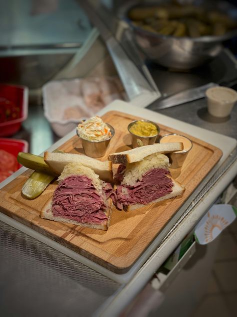 This famous sandwich from Mendy's Kosher Deli is like a Ruben, without the cheese. Sink your teeth into Mendy's tender corned beef on fresh rye, piled high with any or all of these classic accompaniments — coleslaw, sauerkraut, deli mustard, and Russian dressing. Served, of course, with a side of pickles. 

The Jewish deli made famous on "Seinfeld" when Jerry argued with Kenny Bania over whether soup is a dinner is now one of the most popular delis in New York City. Founded by Mendy Merel in 1998, the Glatt-Kosher deli in Manhattan is known for its exceptional corned beef, pastrami, and legendary meal-worthy soups. 

*As seen on Seinfeld, Mendy's is a GLATT KOSHER Delicatessen — under OU Kosher supervision.* Sandwich Combos, Tender Corned Beef, Jewish Deli, Russian Dressing, Mustard Pickles, Jerry Seinfeld, Cole Slaw, Midtown Manhattan, Corned Beef