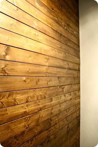 Wood Plank Wall - she used pine planks rather than pallets making this project a WHOLE lot easier. Stained with dark walnut stain. LOVE. Stained Shiplap, Wood Plank Wall, Wooden Accent Wall, Wall Stains, Accent Wall Design, Diy Wood Wall, Wood Plank Walls, Diy Rustic Home, Accent Wall Designs