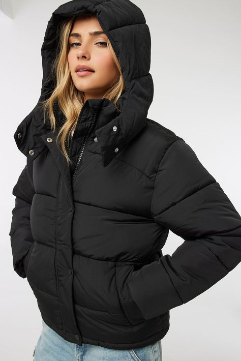 You won't find a better deal! Water-repellent short puffer jacket. Zipper and snap button closures Removable puff hood Fleece-lined pockets Storm cuffs Bungee cinch-cord at hem Matte finish shell: 100% polyester Lining: 100% polyester Filling: 100% polyester Model is wearing size S | Ardene Puffer Jacket with Removable Hood in Black | Size XL | Polyester Macpac Puffer Jacket, Short Puffer Jacket Outfit Winter Style, Black Puffer Jacket With Hood, Winter Jacket Outfits Women, Short Puffer Jacket Outfit, Puffer Jacket Outfit Winter Style, Puff Jacket Outfit, Womens Puffer Jacket, Denim Styling