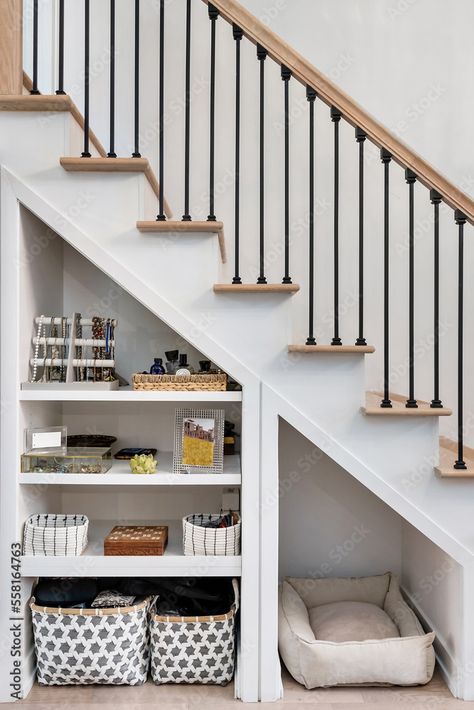 Download Modern Staircase with Open Storage Underneath. Aesthetic organization in small spaces. Metal stair railing with wooden bannister. Stock Photo and explore similar images at Adobe Stock. Wooden Open Stairs, Staircase With Storage Underneath, Underneath Staircase Ideas, Wooden Bannister, Stair Redo, Open Staircase Ideas, Staircase Photos, Small Stairs, Small Entrance Halls