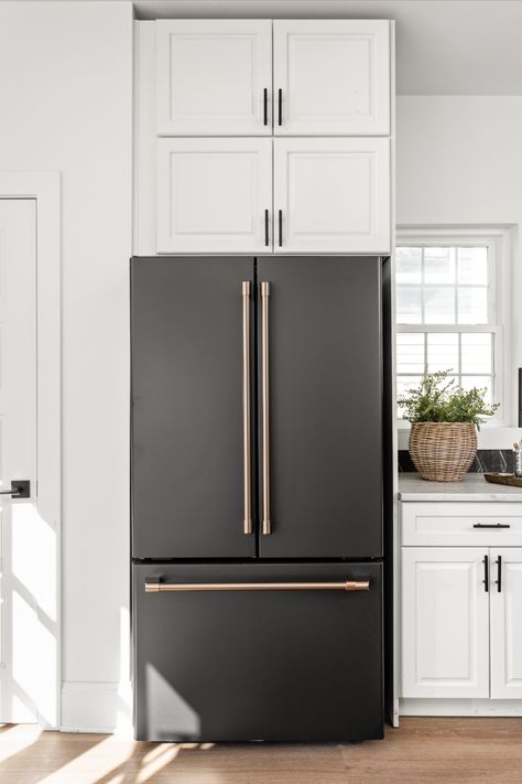 Bring a sense of edgy elegance to your home décor when pairing Matte Black with our Brushed Bronze finish. #CafeAppliances #MatteBlack #BrushedBronze #HomeDecor 

Photo Credit: @thehomeaesthetic 
@twochicksandahammer 

https://www.cafeappliances.com/collections/customizable-professional/matte-black/ Ge Cafe Black Matte, Cafe Matte Black Appliances Kitchen, Black Appliances Gold Hardware, Matte Black Cafe Appliances In Kitchen, Kitchen With Matte Black Appliances, Cafe Appliances Matte Black, Black And Gold Appliances, Matte Black Appliances Kitchen, Black Cafe Appliances