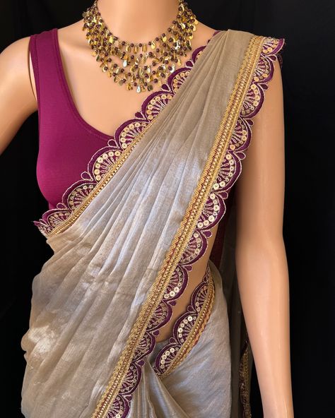 Silver mettalic tissue saree with contrast magenta golden lace all over sarees. Comes with beautiful big magenta thread tassels on pallu. Blouse: running blouse 80cm. To find this product in website: Www.thejacouture > Tissue sarees> silver mettalic tissue saree. Jewellery collaboration: @anvi__jewellery #mettalictissuesaree #silversaree #fancysaree #tissuesaree #trendingsaree #tissuelacesaree Silver Saree With Contrast Blouse, Silver Tissue Saree, Net Saree Designs, Saree Combination, Silver Saree, Saree Inspiration, Saree With Contrast Blouse, Tissue Sarees, Thread Tassels