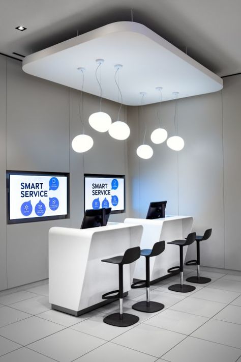 The colour scheme was kept to bright whites, cool greys and a touch of warm off whites. The bright white tones were used on all the Staron solid surface, the back cash wall paneling and ceiling finish to highlight various destination points outside and inside the store. Mobile Phone Store Design, Phone Store Design, Electronics Store Design, Samsung Store, Cash Counter, Display Counter, Mobile Store, Phone Store, Retail Design Blog