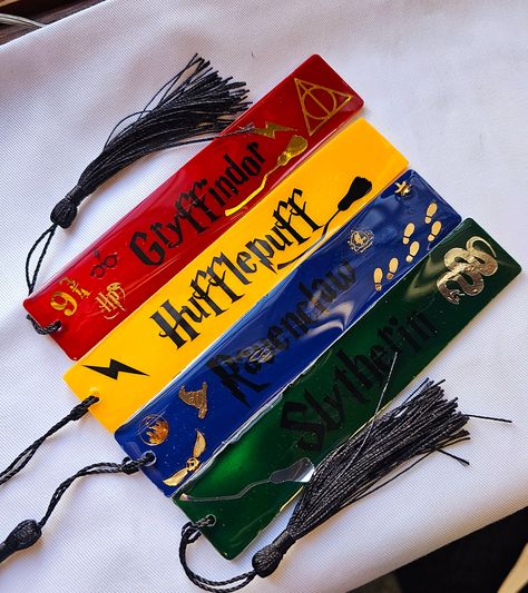 Enhance your reading experience with our Harry Potter bookmarks. These themed bookmarks will transport you to the magical world of Hogwarts, making your reading adventure even more exciting. Crafted with high-quality materials, they are sturdy and durable for long-term use. Perfect for both children and adults who are fans of the beloved series. Personalization (Optional) Name/Initials( If you are ordering the harry potter one and you want the house name on there put the name in this section A g Bookmarks Harry Potter, Harry Potter School Supplies, Resin Notebook, Wizard House, Harry Potter Bookmark, Themed Bookmarks, Number Font, Resin Bookmarks, Harry Potter Set