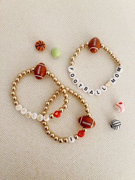 Football, baseball, soccer, basketball, and volleyball bracelets.  Bracelets can be customized with player name or number, school (college or high school name, major league sports name, any sporting terms (home run, touch down, etc.)  Can say "football mom/gf/sister" if wanted!  Red/gold hearts available (pictured) Gold (pictured) and silver hearts available Gold/white letters/numbers or black/white letters/numbers available as well.  PLEASE LEAVE A SPECIFIC DESCRIPTION OF WHAT YOU WANT THE BRACELET TO LOOK LIKE Basketball Bracelets Diy, Volleyball Bracelets, Basketball And Volleyball, Football Bracelet, Touch Down, Bracelets Ideas, Sports Bracelet, Gold Hearts, Beads Bracelet Design